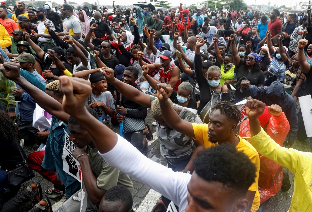 FILE PHOTO: Demonstrators gesture during a protest over alleged police brutality, in Lagos, Nigeria October 14, 2020. REUTERS/Temilade Adelaja/File Photo